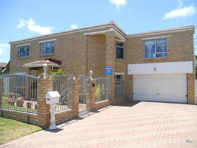 Completed double-storey face-brick home built by Honey Bee Construction